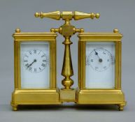A miniature gilt double carriage clock/barometer. 12 cm wide.