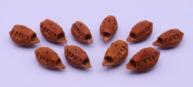 Ten Canton carved nut boats. Each approximately 3.75 cm long.