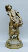A bronze of a female goatherd. 64 cm high.