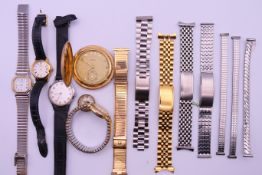 A quantity of wristwatches, watch straps and a compass. The latter 1.