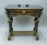 A 19th century carved oak side table. 85 cm wide.