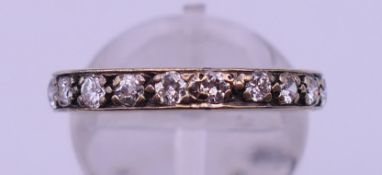 A diamond eternity ring. Ring size P/Q.