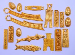 A quantity of gold-coloured metal bars. The largest 17 cm long.