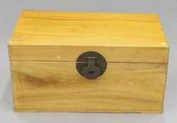 An Eastern camphor wood trunk. 93 cm wide.