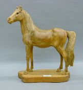 School of Faust Emmanuel Lang (1887-1973), a carved wooden horse on a wooden plinth base. 38.