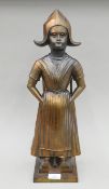 An early 20th century Dutch girl companion set. 52 cm high.