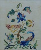 A floral embroidered panel, framed and glazed. 52 x 43 cm.