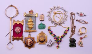 A quantity of miscellaneous jewellery medallions and a lorgnette. The latter 14.5 cm high.