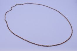 A gold-plated muff chain. 100 cm long.