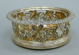 A Georgian silver bottle coaster. 15 cm diameter.