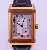 A Jaeger Le Courte 18 K gold gentlemen's Reverso wristwatch, boxed and with paperwork. 3 cm wide.