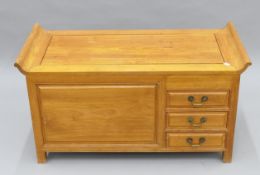 A Chinese elm low side cupboard. 95 cm wide x 50 cm high.