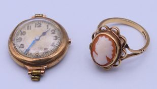 A 9 ct gold cameo ring and a 9 ct gold cased ladies' wristwatch. The watch 2 cm diameter.