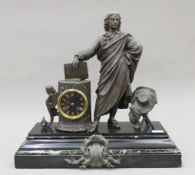 A Victorian patinated spelter-mounted black slate and marble mantle clock. 55 cm wide.