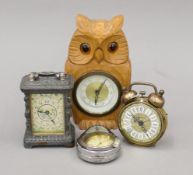 A carved wooden owl-form clock, two other clocks and a ladies' fob watch. The former 14.5 cm high.