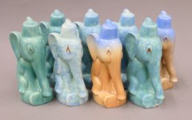 A collection of pottery elephants. Each 19 cm high.