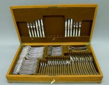 A canteen of Victorian Old English bead-edged silver flatware hallmarked for London 1863,