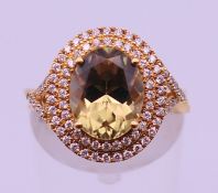 An 18 K gold diamond and turkizite ring. Ring size K. 4.4 grammes total weight.