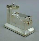 A silver table cigar cutter. 13 cm long.