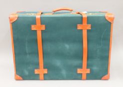 A vintage Henry's London canvas and leather suitcase. 78 cm wide.