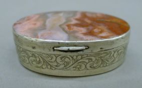 A 19th century unmarked silver and agate snuff box. 7 cm wide.