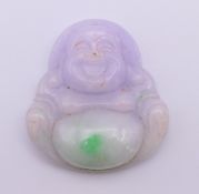 A lilac jade Buddha pendant. 5.3 cm high.