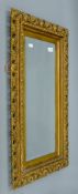 A gilt framed bevelled wall mirror. 87 x 49 cm.