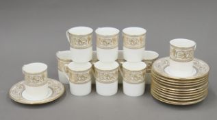 A Royal Doulton Sovereign pattern coffee set. The cups each 7 cm high.