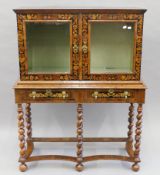 An 18th century marquetry inlaid cabinet on stand. 105 cm wide x 144 cm high.