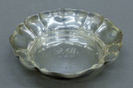A small silver bonbon dish with engraved initials. 11 cm diameter. 67.6 grammes.