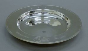 A cased silver presentation dish. 25.5 cm diameter. 685.7 grammes.