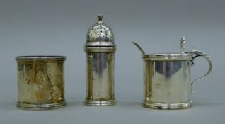 A three-piece silver cruet set bearing the Minto-Elliot crest. The pepper 8.5 cm high. 209.