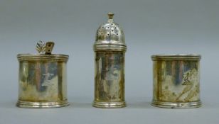 A three-piece silver cruet set bearing the Minto-Elliot crest. The pepper 8.5 cm high. 215.