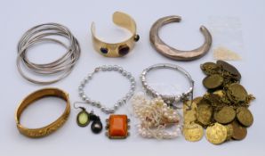 A quantity of various jewellery. The engraved bangle 6 cm inner diameter.