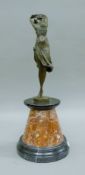 A bronze model of an Art Deco-style dancing girl on a marble plinth base. 47.5 cm high.
