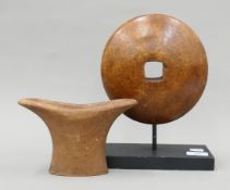 A wooden sculpture on stand and a treen vessel. The former 28 cm high overall.