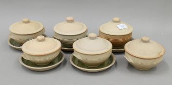 Six David Leach lidded soup bowls and five saucers. The former each 14 cm wide.