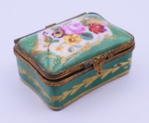 A Continental porcelain pill box. 5.5 cm wide.