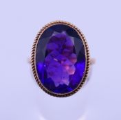 A 9 ct gold and amethyst ring. Ring size O/P. 4.8 grammes total weight.