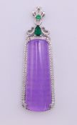 An Art Deco style lilac jade pendant. 6 cm high including suspension loop.