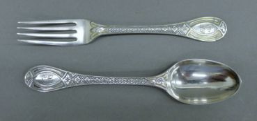 A Victorian silver christening spoon and fork. The spoon 16 cm long. 71.4 grammes.
