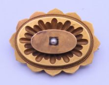 A Victorian 15 ct gold seed pearl set mourning brooch. 3.5 cm wide 7.9 grammes total weight.