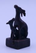 A bronze double deer seal. 5 cm high.