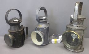 Three railway signalling lamps, one by Veritas Lamp Works London which has been electronically