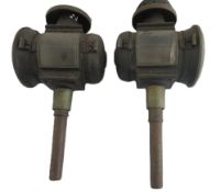Pair of antique brass and metal carriage lamps featuring large circular glass lenses and long