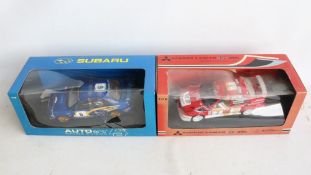 Two 1/18th scale diecast 2001 season WRC model cars from AutoArt to include 80193 Subaru Impreza #