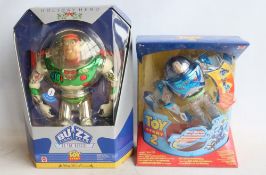 Two boxed and unopened/sealed Buzz Lightyear action figures from Mattel to include a Holiday Hero