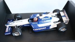 Two 1/18 scale diecast F1 racing car models from Minichamps to include 100 020096 2002 Williams