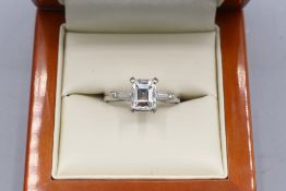 Hallmarked platinum (950) emerald-cut diamond solitaire ring, comprising one central emerald-cut