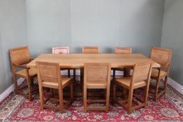 Malcolm Foxman Pipes - an adzed oak rectangular dining table, on octagonal end supports with floor